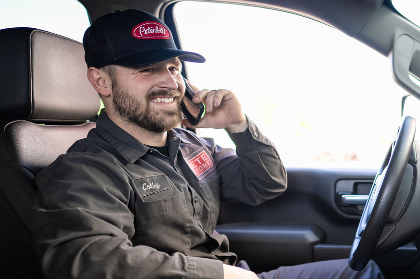 Mobile Service Diesel Technician on the phone with a customer