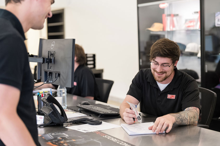 Pete Store Parts counter employee assisting customer