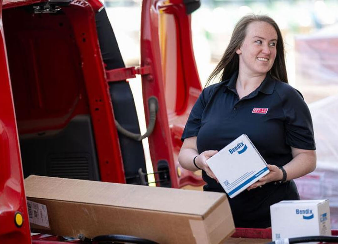 Pete Store Employee wearing a Pete Store shirt unloading our parts van