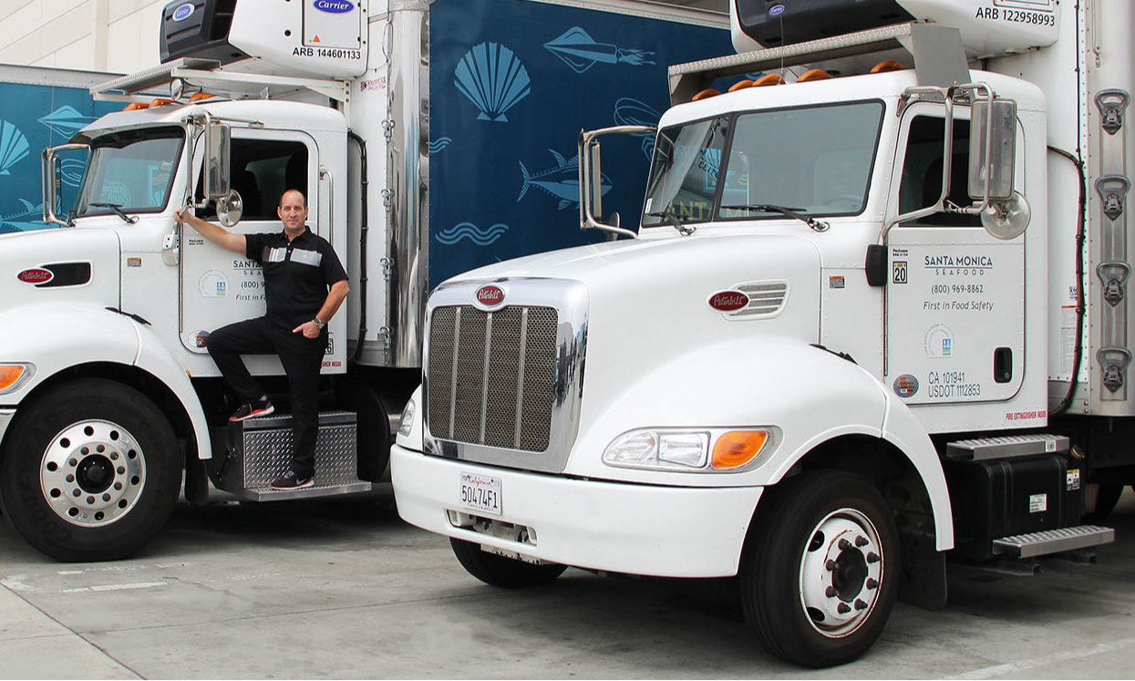 Truck driver with two Peterbilt 579 Models